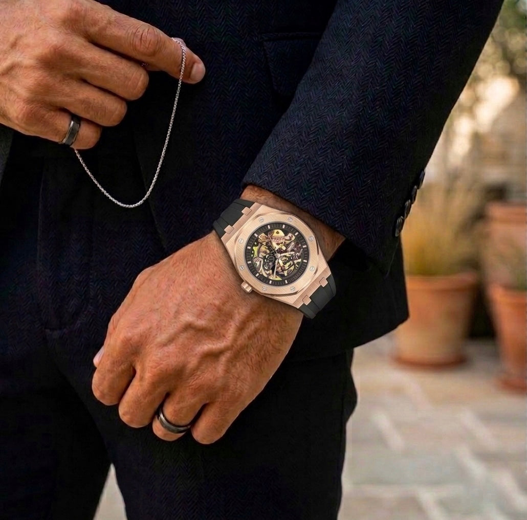 Man wearing Noble Oak rose gold watch with black suit