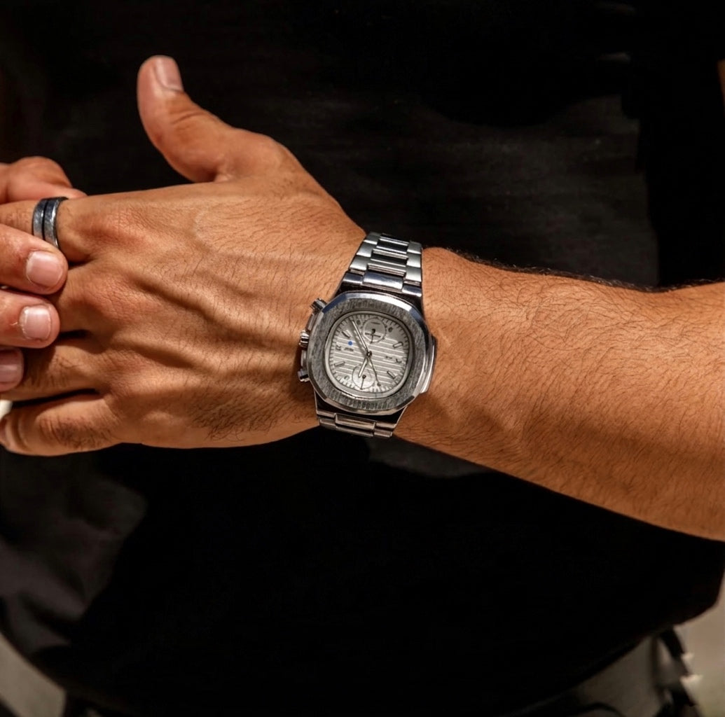 Men's silver Meridian watch on wrist 