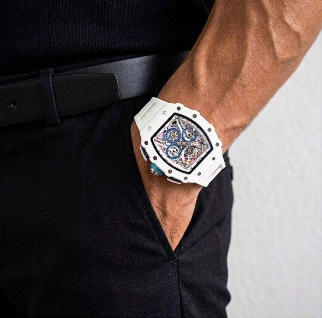 White skeleton dial luxury watch on man's wrist