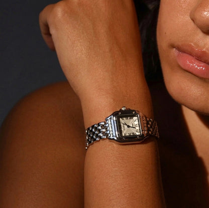 Woman wearing the silver Lumiere rectangular jewelry watch on her wrist